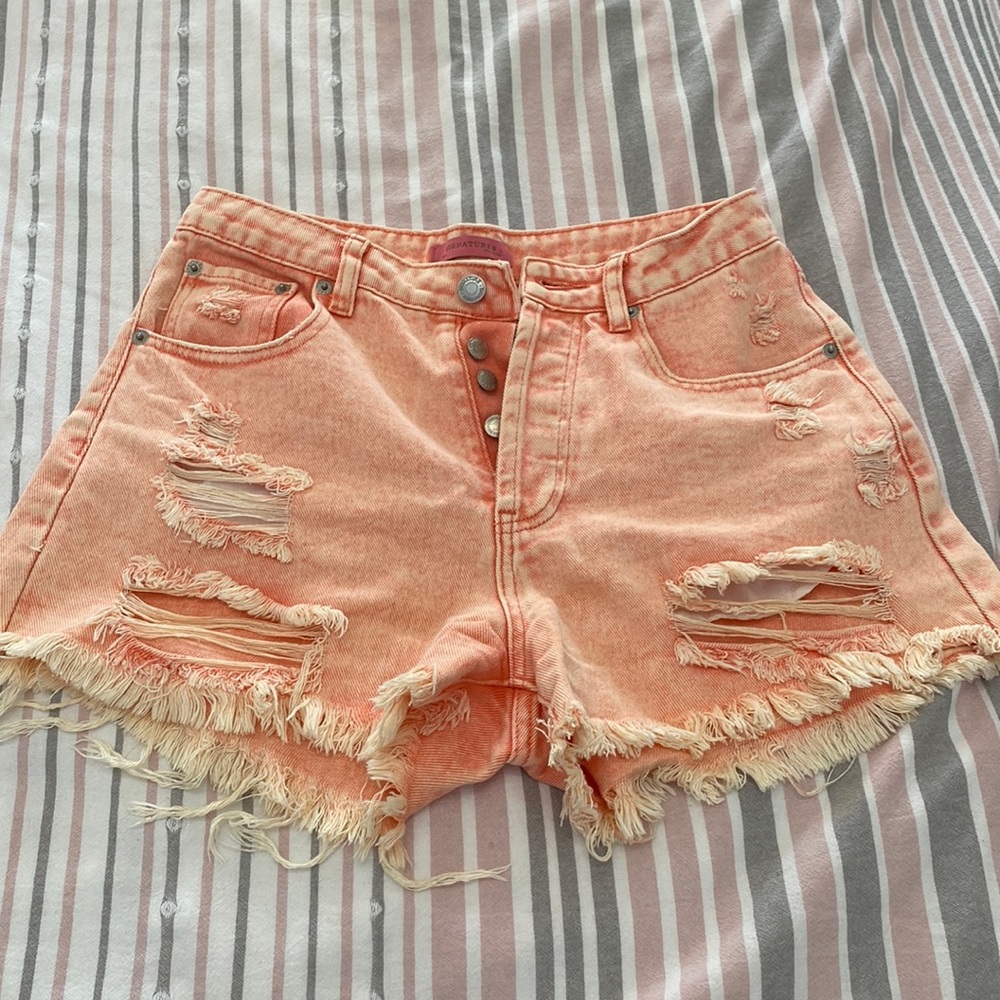 Signature8 size small faded orange high rise ripped shorts Jean material